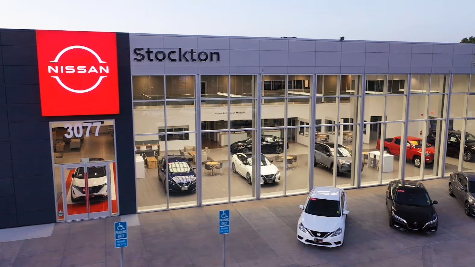 Front of dealership at dusk